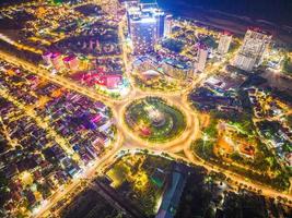 Vung Tau view from above, with traffic roundabout, house, Vietnam war memorial in Vietnam. Long exposure photography at night.
