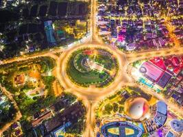 Vung Tau view from above, with traffic roundabout, house, Vietnam war memorial in Vietnam. Long exposure photography at night. photo