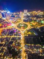 Vung Tau view from above, with traffic roundabout, house, Vietnam war memorial in Vietnam. Long exposure photography at night. photo