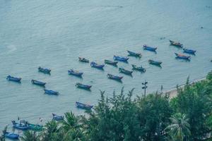 Aerial view many local culture Vietnam. Top view of local fisherman boats in the deep blue sea, tropical seascape. Travel destination Asia concept and background. photo