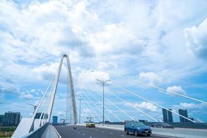 Ho Chi Minh city, Vietnam - MAY 22 2022 Thu Thiem 2 bridge, connecting Thu Thiem peninsula and District 1 across the Saigon River in Bach Dang port photo