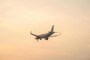 Ho Chi Minh city, Vietnam - FEB 20 2022 Airplane fly over urban areas preparing landing into Tan Son Nhat International Airport and takes off in TSN airport photo