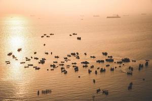 Aerial view many local culture Vietnam. Top view of local fisherman boats in the deep blue sea, tropical seascape. Travel destination Asia concept and background. photo