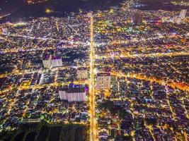 Vung Tau view from above, with traffic roundabout, house, Vietnam war memorial in Vietnam. Long exposure photography at night. photo