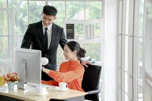 Business people working at computer in office photo