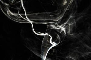 Smoke effect texture. Isolated background. Black and dark backdrop. Smokey fire and mistic effect. photo