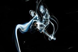 Smoke effect texture. Isolated background. Black and dark backdrop. Smokey fire and mistic effect. photo