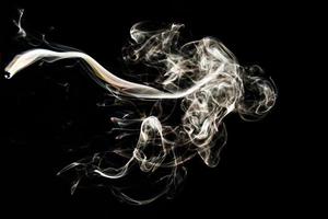 Smoke effect texture. Isolated background. Black and dark backdrop. Smokey fire and mistic effect. photo