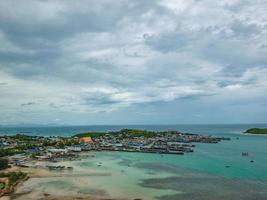 ViewPoint on the mountain with Fisherman townscape with idyllic ocean and rainy cloud sky in vacation time,Chonburi thailand,holiday concept photo