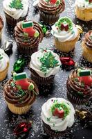 Christmas decorated cupcakes in chocolate and vanilla photo