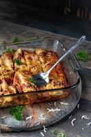 baked cannelloni pasta with spinach, ricotta in glass pan