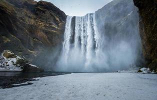 Skogafoss waterfall one of the best known waterfalls in southern Iceland. photo