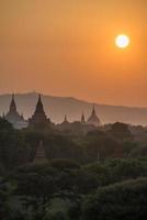 The silhouette of the ancient pagoda in Bagan one of UNESCO world heritage site and the first empire of Myanmar at sunset. photo