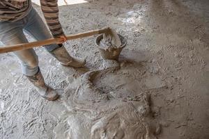 Worker is  mixing mortar photo