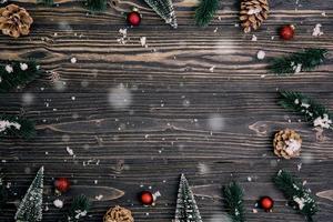 Christmas holiday composition decoration on wooden background, new year and xmas or anniversary with presents on wood table in season, top view or flat lay. photo