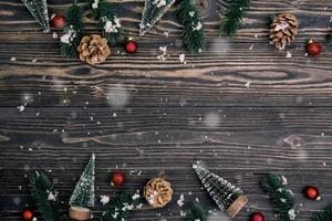 Christmas holiday composition decoration on wooden background, new year and xmas or anniversary with presents on wood table in season, top view or flat lay. photo
