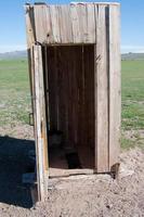 Wooden latrine in rural Mongolia photo