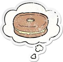 cartoon biscuit and thought bubble as a distressed worn sticker vector