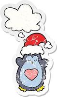 cute christmas penguin and thought bubble as a distressed worn sticker vector