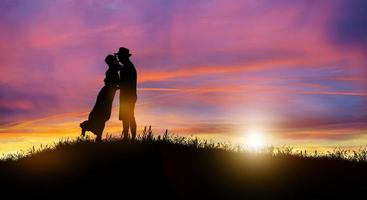 Silhouette of Couple, Lover, Relationship at twilight landscape. photo