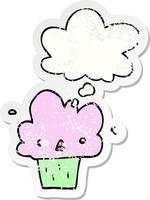 cartoon cupcake and thought bubble as a distressed worn sticker vector