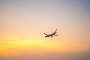 Ho Chi Minh city, Vietnam - FEB 20 2022 Airplane fly over urban areas preparing landing into Tan Son Nhat International Airport and takes off in TSN airport photo