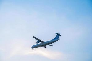 Ho Chi Minh city, Vietnam - FEB 20 2022 Airplane fly over urban areas preparing landing into Tan Son Nhat International Airport and takes off in TSN airport photo