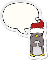 pingüino de navidad de dibujos animados y etiqueta engomada de la burbuja del discurso vector