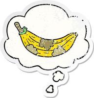 cartoon old banana and thought bubble as a distressed worn sticker vector