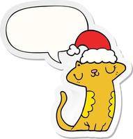 cute cartoon cat wearing christmas hat and speech bubble sticker vector