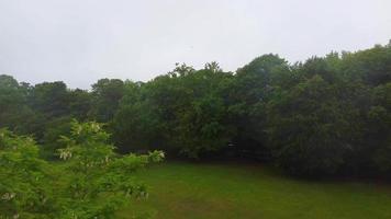 Aerial and High Angle Footage of Local Public Park on a Cloudy Day, Wardown Park is situated on the River Lea in Luton. The park has various sporting facilities, video