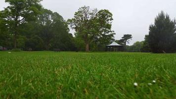 Aerial and High Angle Footage of Local Public Park on a Cloudy Day, Wardown Park is situated on the River Lea in Luton. The park has various sporting facilities, video