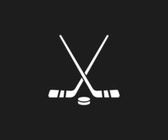 icono de palos de hockey y disco vector