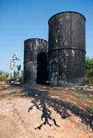 pump jack with crude oil contamination photo