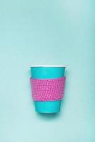 Mockup of coffee paper cup on a green background. photo