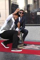 LOS ANGELES, OCT 10 - Usher, Kenny Babyface Edmonds at the Kenny Babyface Edmonds Hollywood Walk of Fame Star Ceremony at Hollywood Boulevard on October 10, 2013 in Los Angeles, CA photo