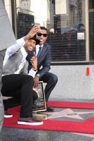 LOS ANGELES, OCT 10 - Usher, Kenny Babyface Edmonds at the Kenny Babyface Edmonds Hollywood Walk of Fame Star Ceremony at Hollywood Boulevard on October 10, 2013 in Los Angeles, CA photo