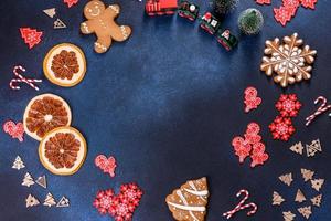 Christmas homemade gingerbread cookies on a dark concrete table photo