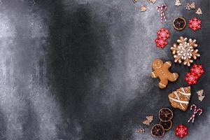 Christmas homemade gingerbread cookies on a dark concrete table photo