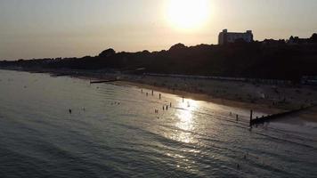high angle video footage of Bournemouth sea side and Aerial city view of buildings and hotels, Bournemouth is a coastal resort town in the Bournemouth,