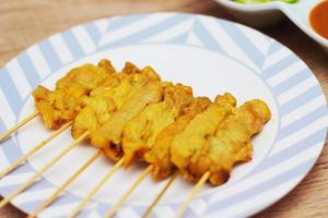 Pork satay,Grilled pork served with peanut sauce or sweet and sour sauce, Thai Street food. photo