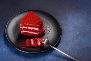 Red velvet cake, classic three layered cake from red butter sponge cakes with cream photo