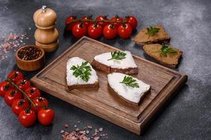 Sliced bread with cream cheese and butter for breakfast photo