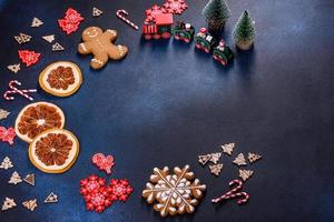 Christmas homemade gingerbread cookies on a dark concrete table photo