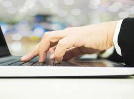 Business man is using laptop computer in his office photo