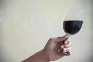 Man hold glass of wine - toast celebration concept photo