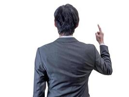 backview of businessman points his finger up. photo