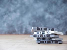 Cassette tapes over wooden table with grunge background.retro filter. photo