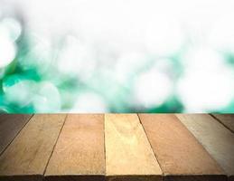 Empty wooden table in front of bokeh lights background. photo