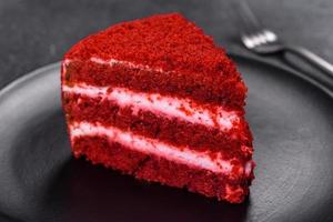 Red velvet cake, classic three layered cake from red butter sponge cakes with cream photo